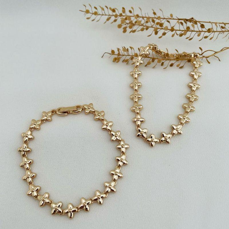 12.2049.0.O - Pulseira de margaridas de quatro pétalas lisas com fecho relogio