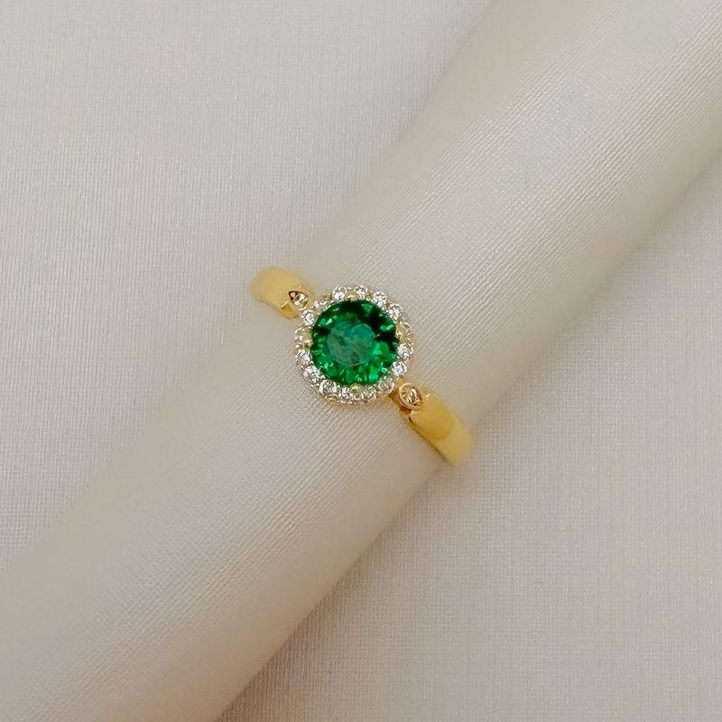 03.2637.5.O - (19) Anel solitário de pedra circular com uma linha de aura em aro com mini gota