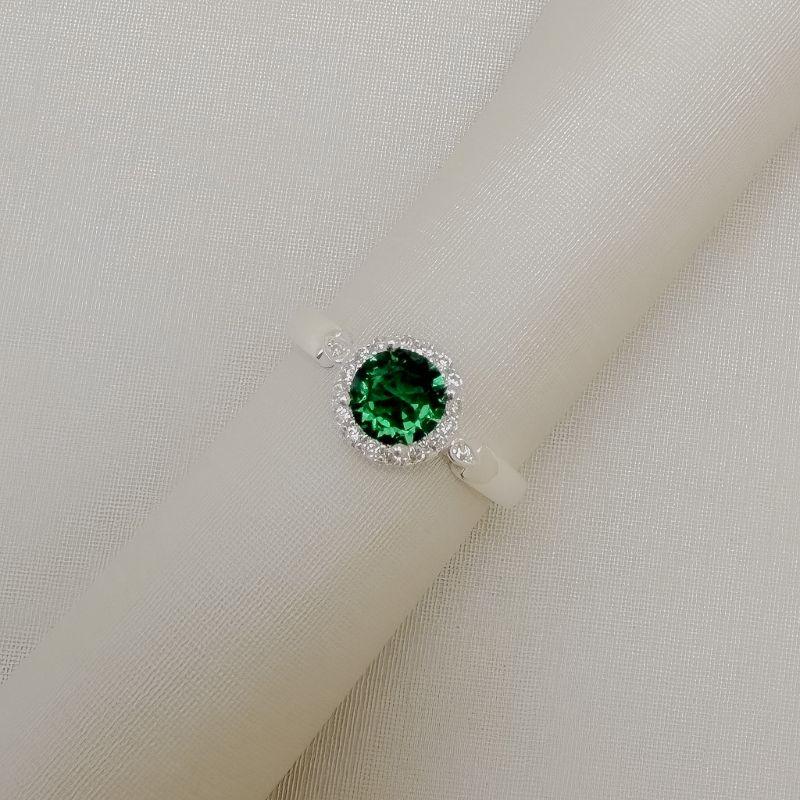 03.2637.5.S - (18) Anel solitário de pedra circular com uma linha de aura em aro com mini gota