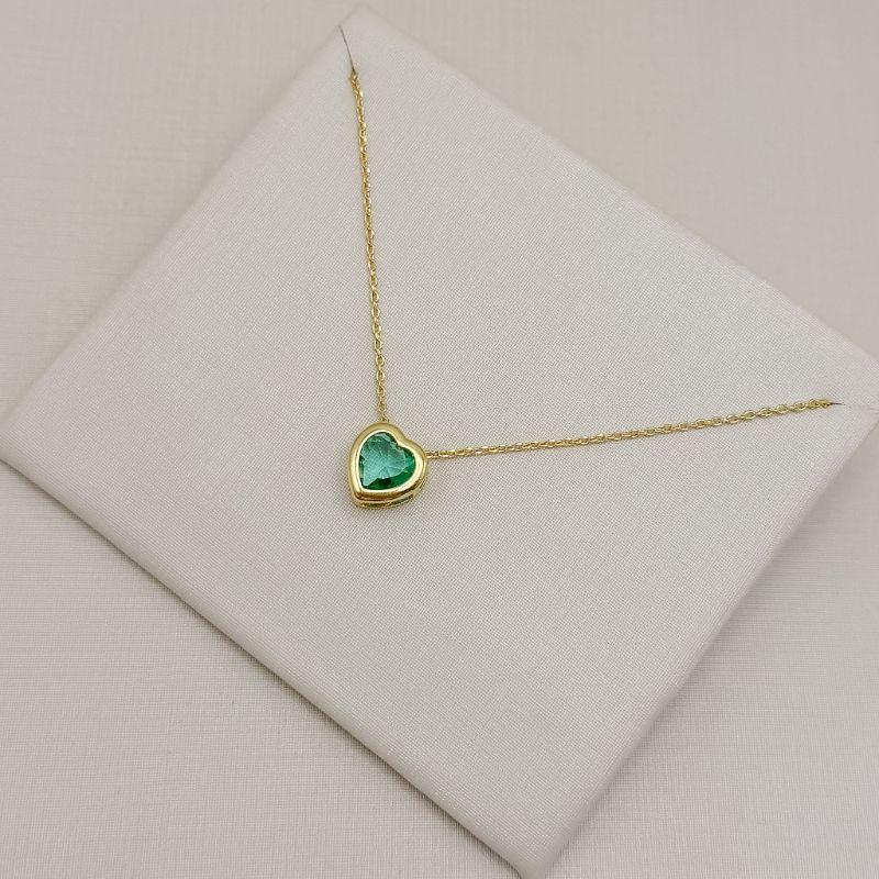 09.2554.9.O - (45) Colar de elos cartier com pingente de coração em cravação inglesa com galeria