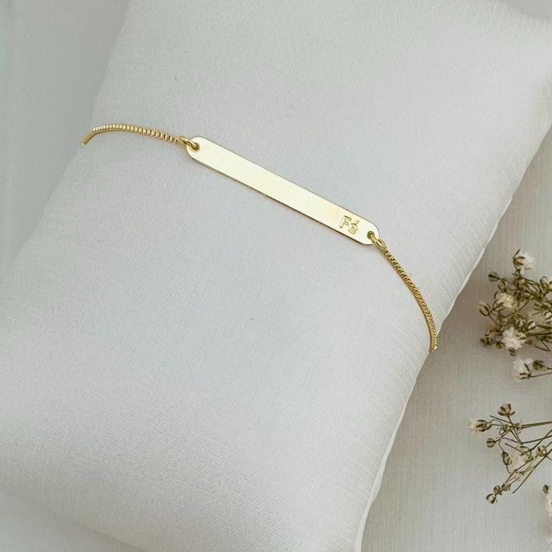 12.2093.0.O - Pulseira veneziana com meio de chapa lisa e pequena escrita FÉ
