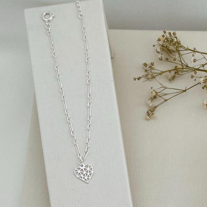12.2109.0.S - Pulseira de elos ovais em formato figaro com pingente diamante liso