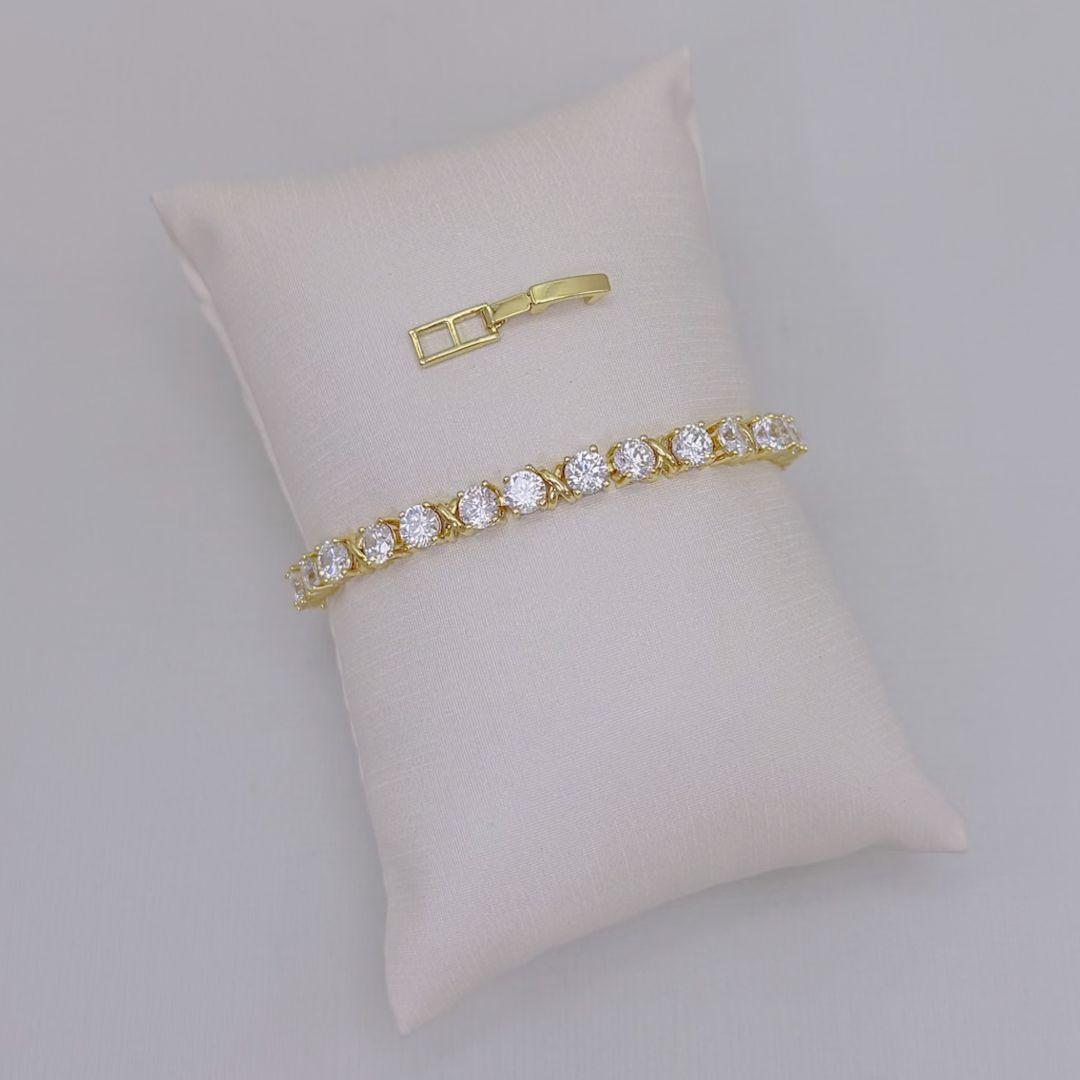 12.2387.1.O - Pulseira riviera clássica com X liso intercalado entre zircônias