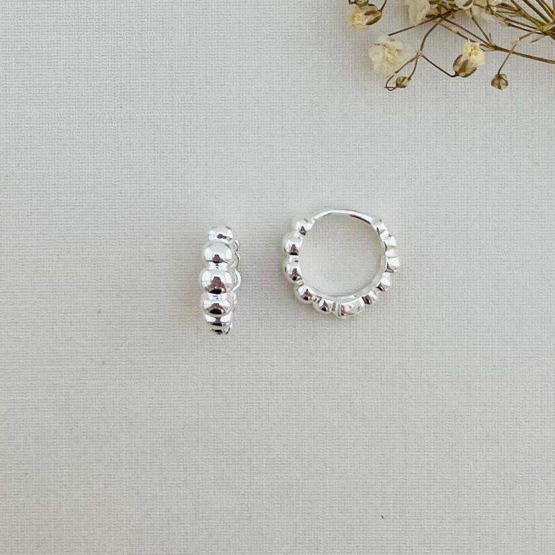 05.2852.0.S - Argola de tubo em cinco bolas lisas ovaladas