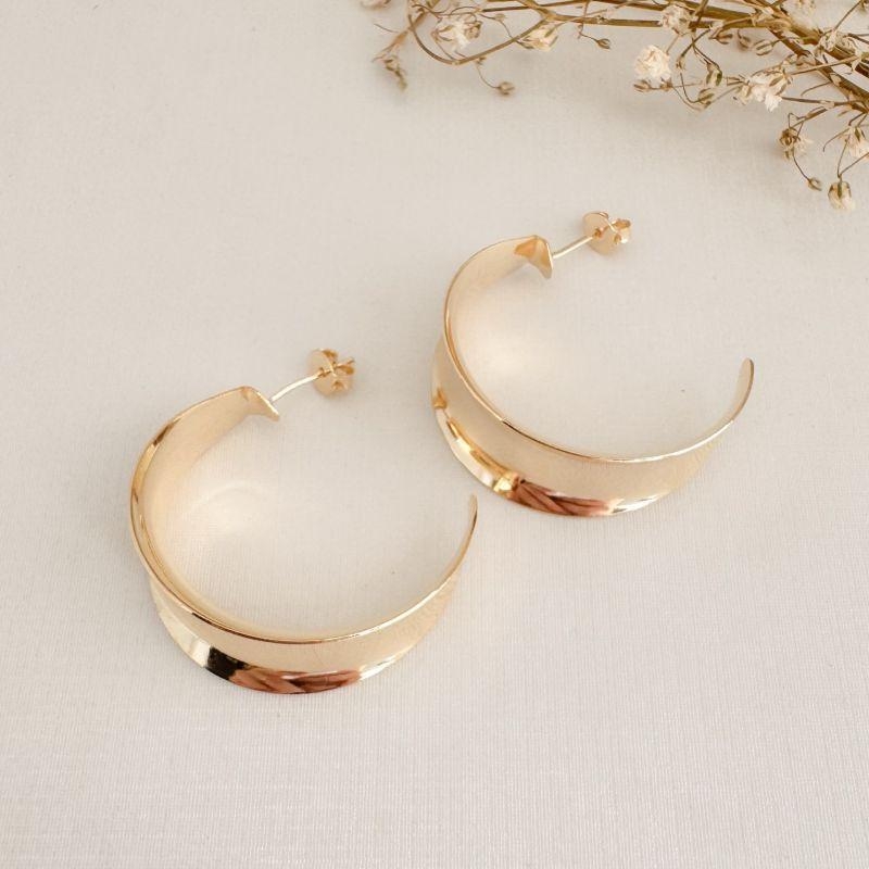 06.1844.0.O - Brinco de tarraxa em chapa formato meia lua