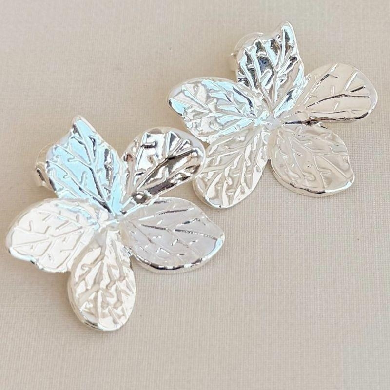 06.1850.0.S - Brinco de chapa em flor estrela desenhada