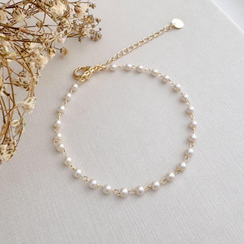 12.2205.15.O - Pulseira de pérolas pequenas espaçadas