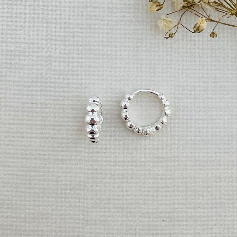 05.2852.0.S - Argola de tubo em cinco bolas lisas ovaladas