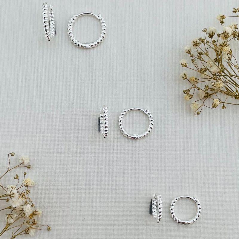 05.2871.0.S - Trio de argolas de tubo em efeito torcida lisa