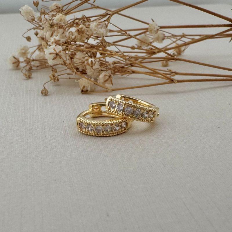 05.2974.1.O - Argola uma coluna cravejada de garras e borda larga em spike tamanho P