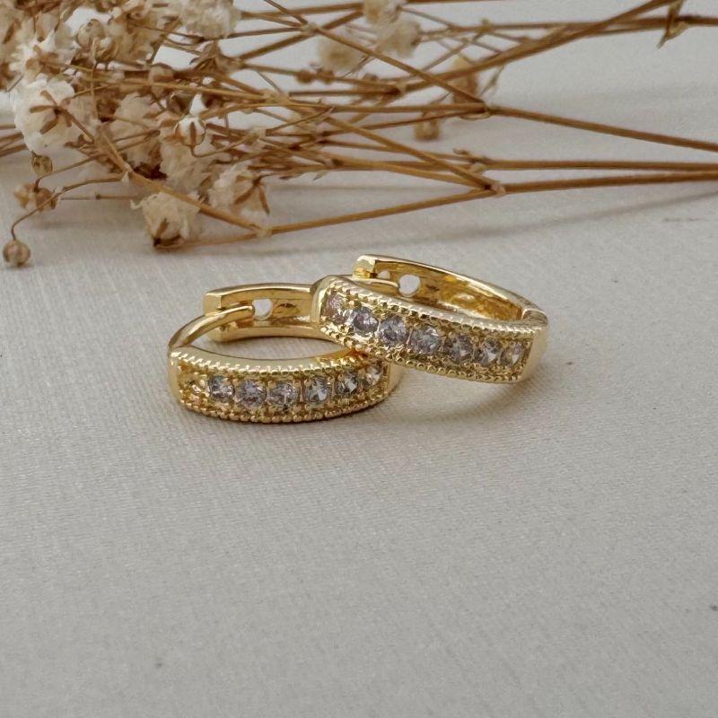 05.2975.1.O - Argola uma coluna cravejada de garras e borda larga em spike tamanho M