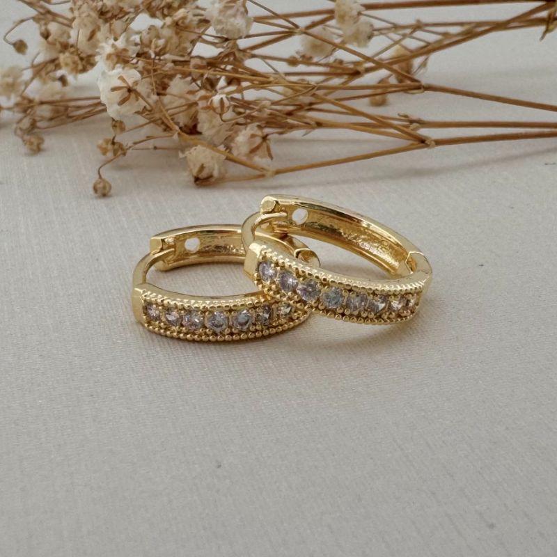 05.2976.1.O - Argola uma coluna cravejada de garras e borda larga em spike tamanho G