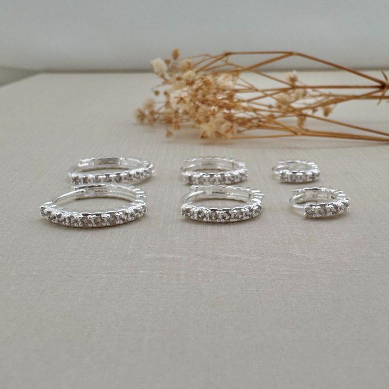 05.3007.1.S - Trio de argolas de uma coluna de cravação em técnica garras