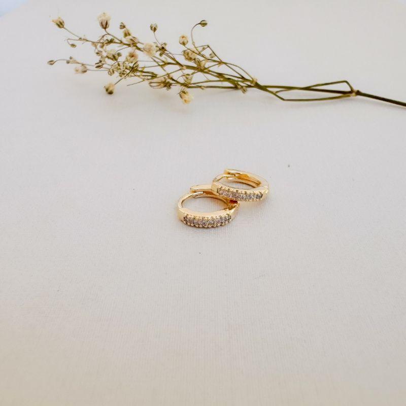 05.3028.1.O - (Tam. P) Argola circular de uma coluna de cravação em garras e borda reta