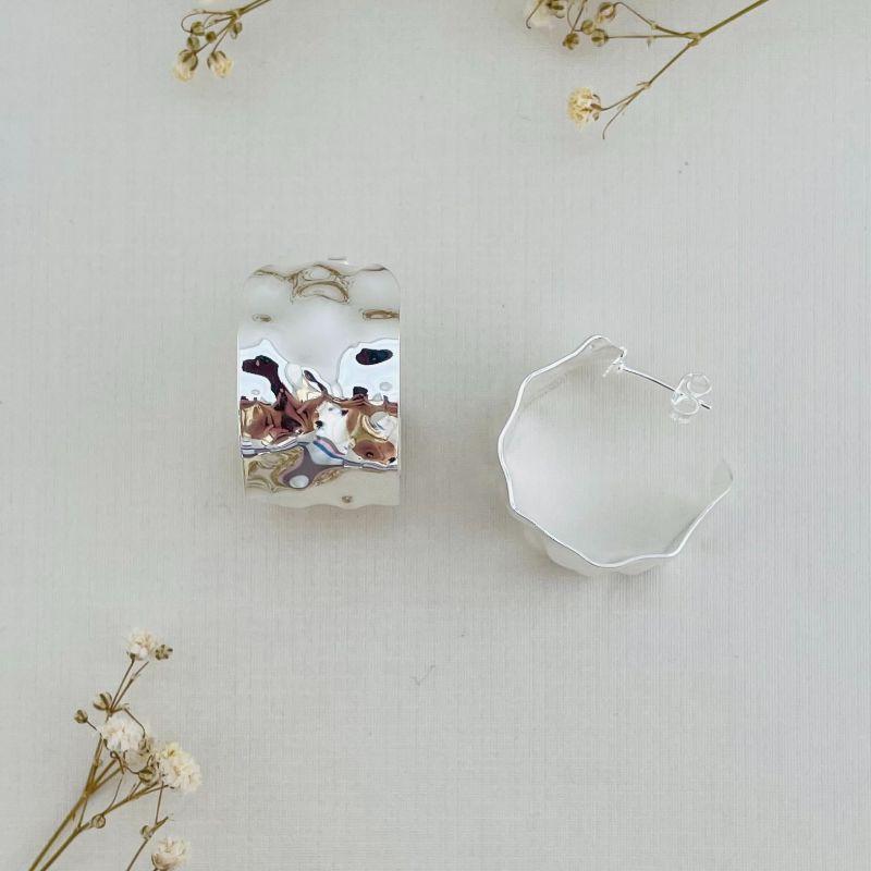 06.1797.0.S - Brinco de tarraxa em chapa circular em efeito organico