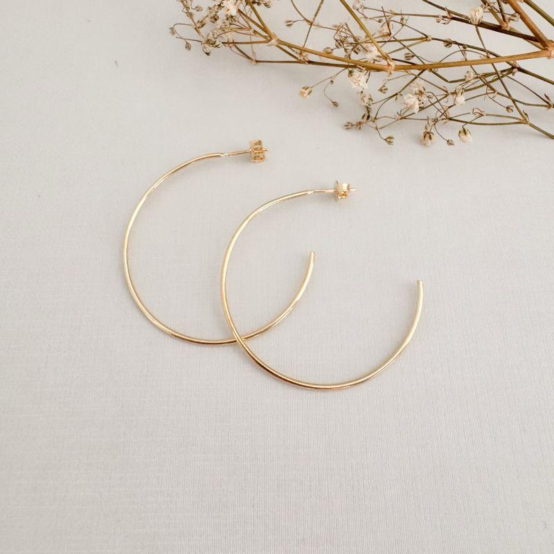 06.1861.0.O - Brinco de tubo liso circular de tarraxa