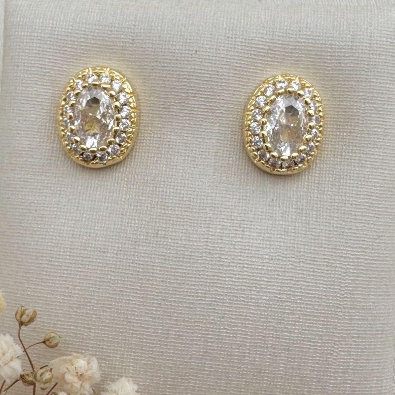 07.2669.1.O -  Brinco oval de pedra grande central com uma fileira cravejada em volta com spikes