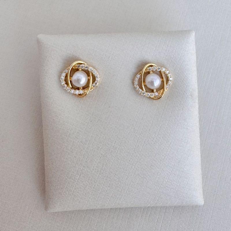 07.2696.15.O - (Tam.G) Brinco de efeito anéis planetários com pérola central