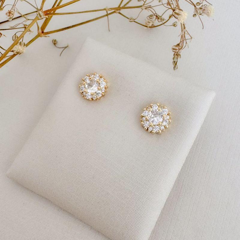 07.2700.1.O - Brinco de ponto de luz central com uma fileira de cravação em volta