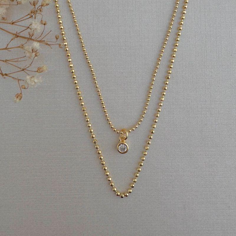 09.2248.1.O - (35 - 40) Colar duplo de malha em bolinhas lisas, menor com pingente ponto de luz