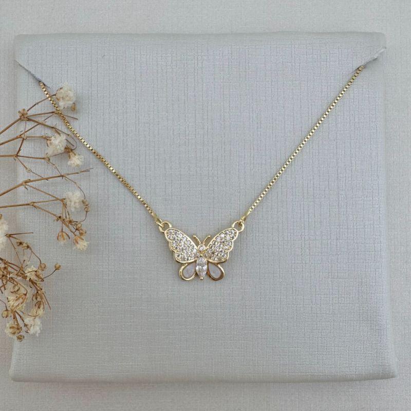 09.2284.1.O - (45) Colar de veneziana metade de borboleta cravejada e medra pérola