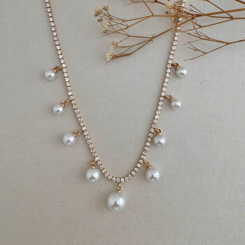 09.2328.15.O - (40) Colar de riviera com nove pingentes de perolas