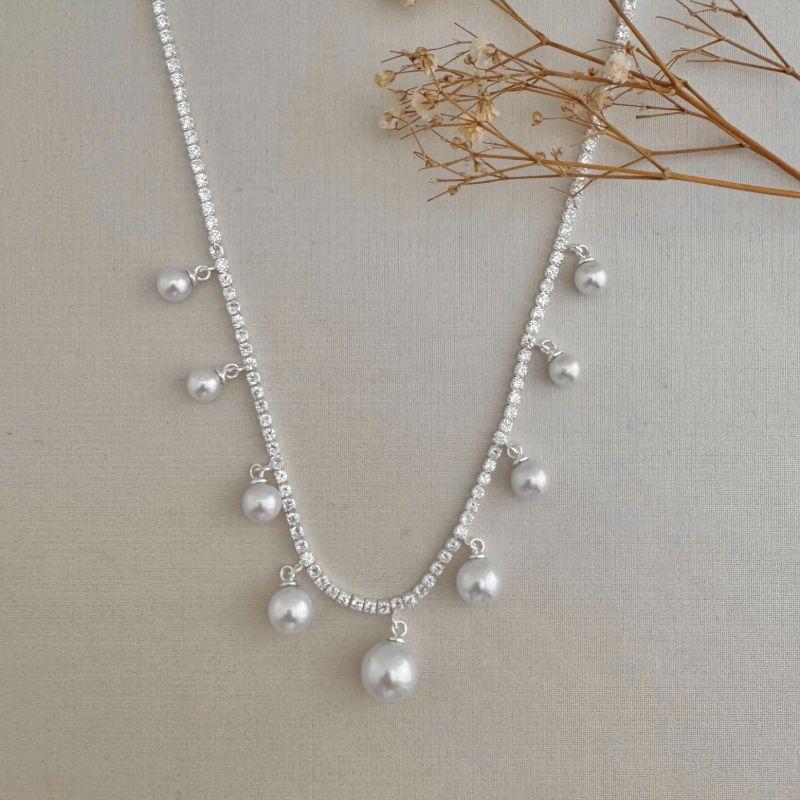 09.2328.15.S - (40) Colar de riviera com nove pingentes de perolas