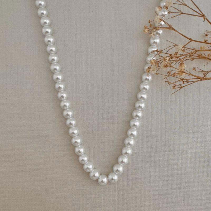 09.2335.15.O - (45) Colar de perolas em fio com fecho lagosta cravejado