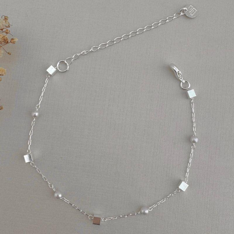 12.2135.15.S - Pulseira de elos longos com pérola e quadrados lisos
