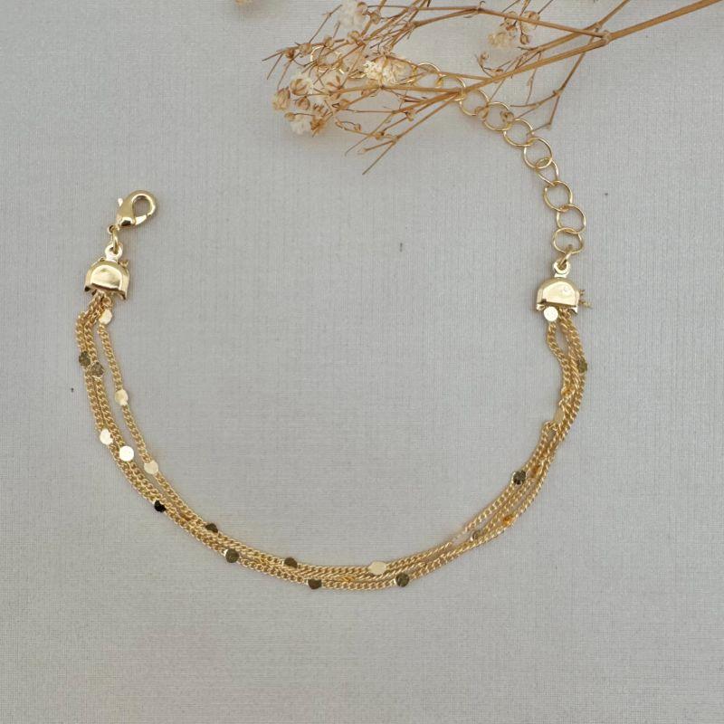 12.2163.0.O - Pulseira tripla de elos clássicos com mini circulos lisas