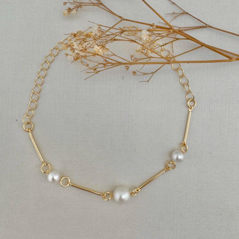 12.2168.15.O - Pulseira de traços longos lisos com perolado circular