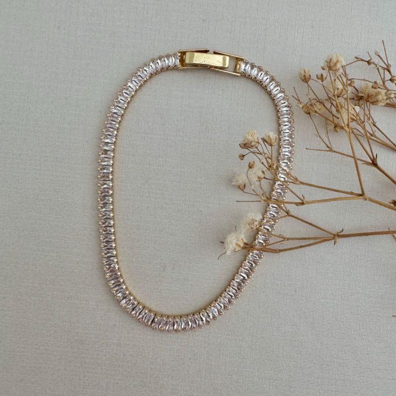 12.2173.1.O - Pulseira de riviera baguetes em vertical com fecho relógio