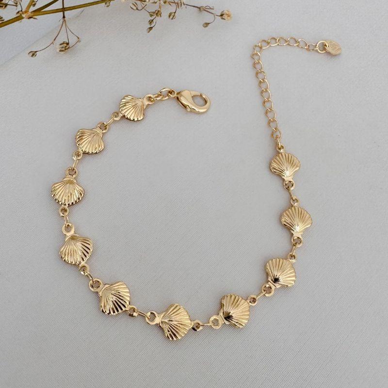 12.2176.0.O - Pulseira por inteiro em conchas desenhadas lisas