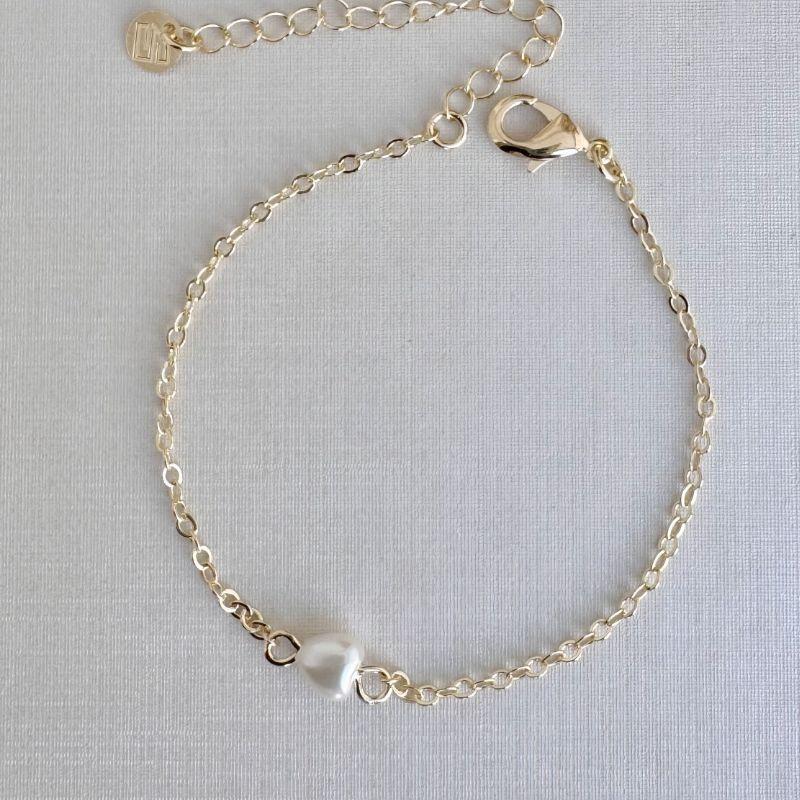 12.2184.15.O - Pulseira de elos ovais com coração perolado central