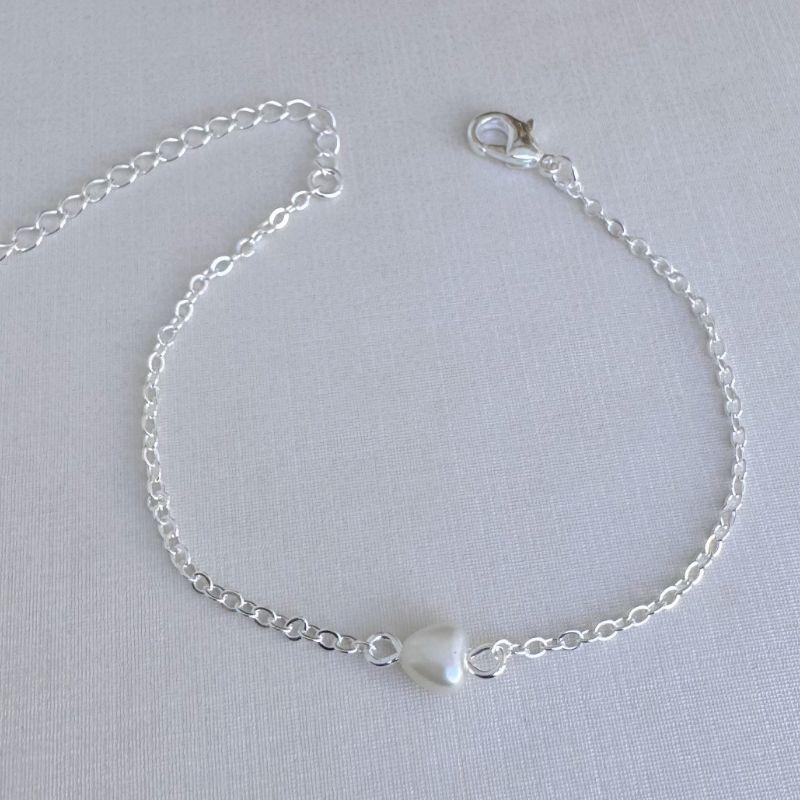 12.2184.15.S - Pulseira de elos ovais com coração perolado central