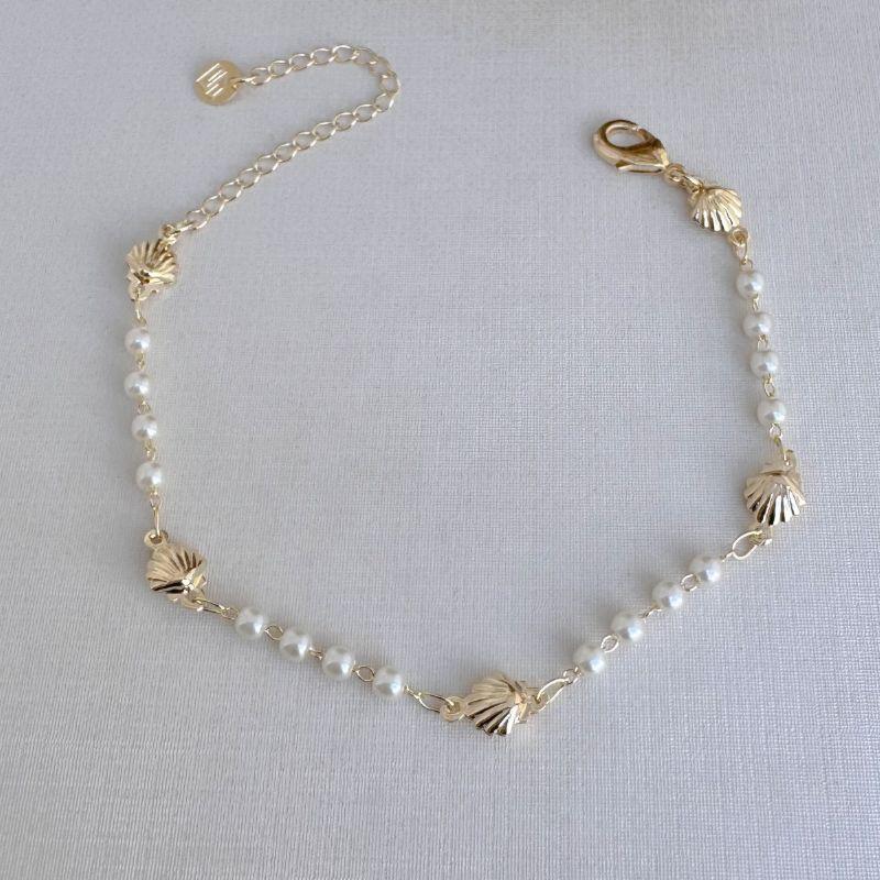 12.2185.15.O - Pulseira de pérolas com conchas lisas espaçadas