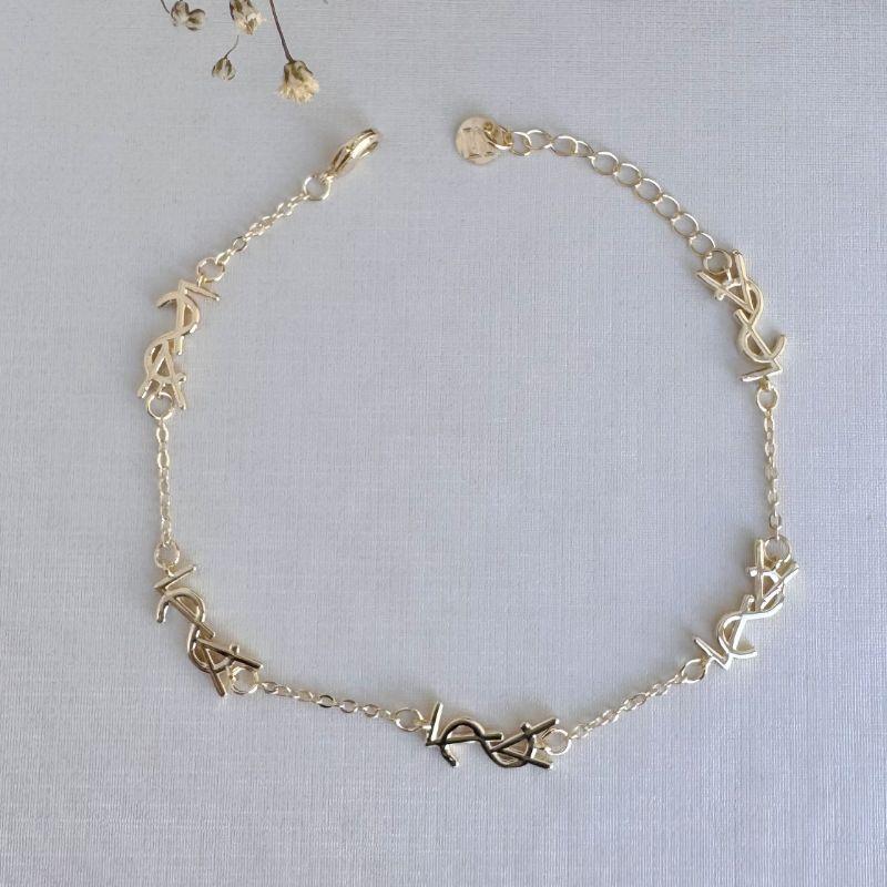 12.2187.0.O - Pulseira de elos circulares com letras polidas lisas. Insp Yves