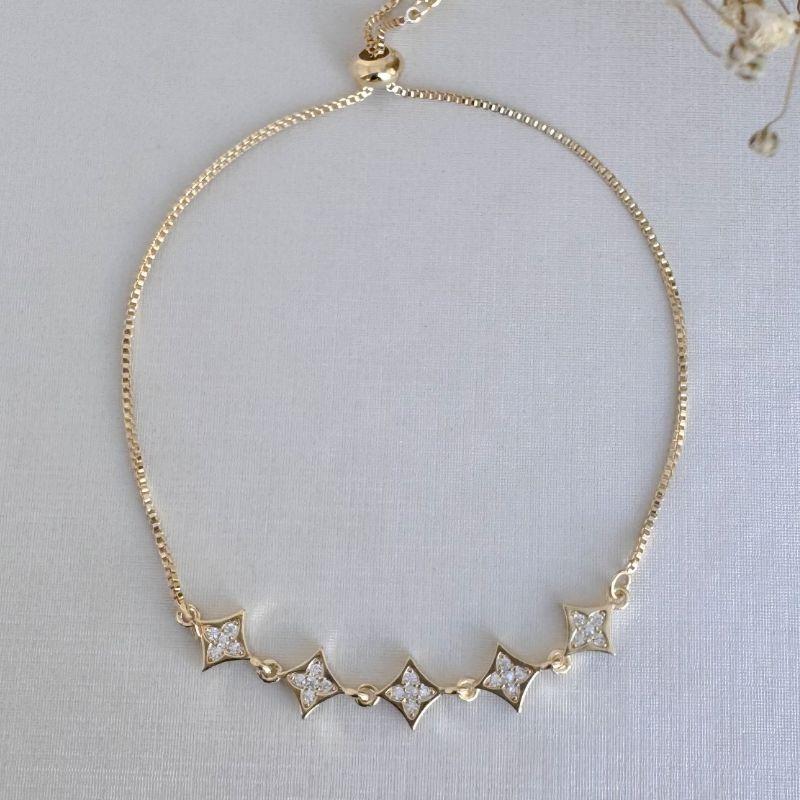 12.2189.1.O - Pulseira de cinco quadrados de pontas com cravação de flor estrela