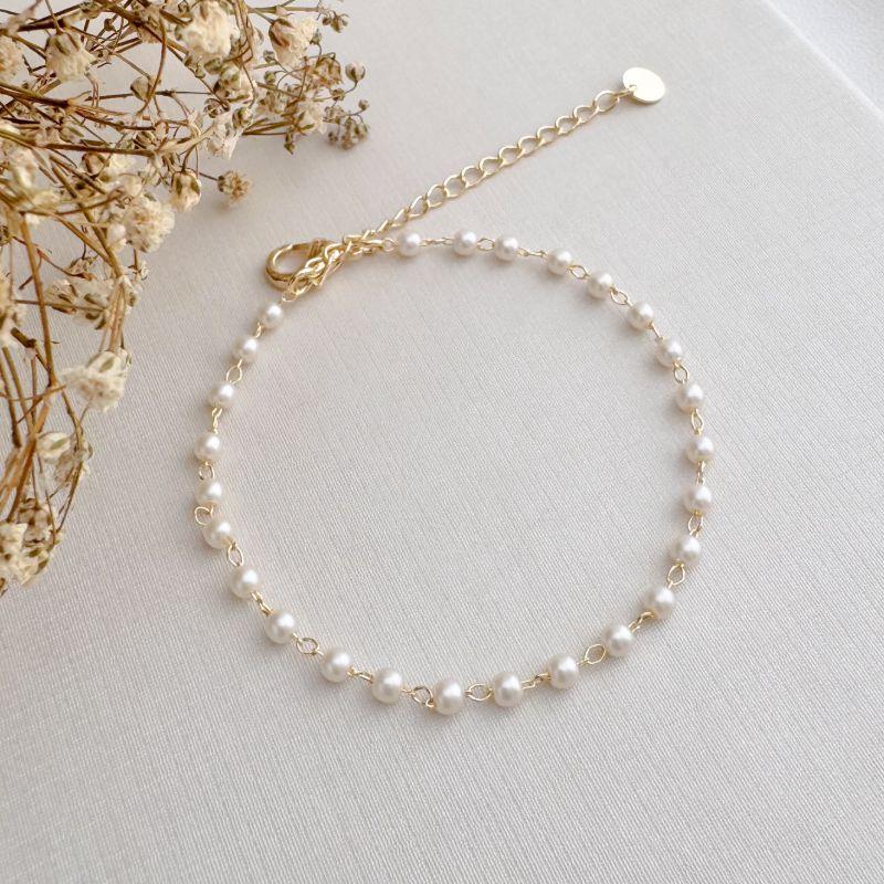 12.2205.15.O - Pulseira de pérolas pequenas espaçadas