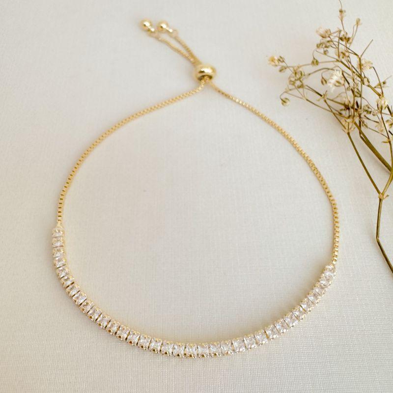 12.2210.1.O - Pulseira de riviera de duas garras com fecho gravata