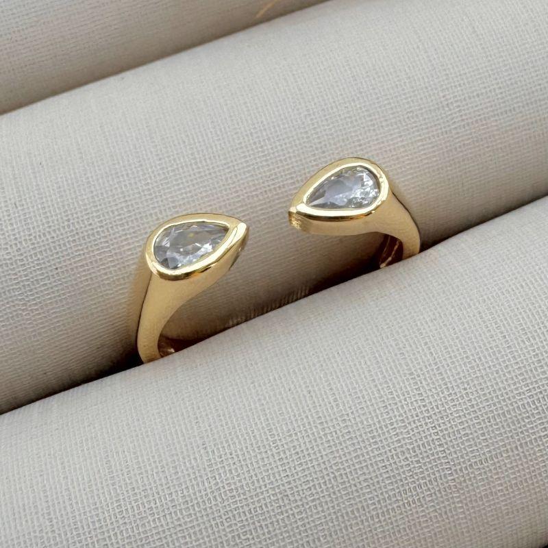 03.2320.1.O - (16 ao 19) Anel de aro aberto com pontas em gota de cravação gipsy