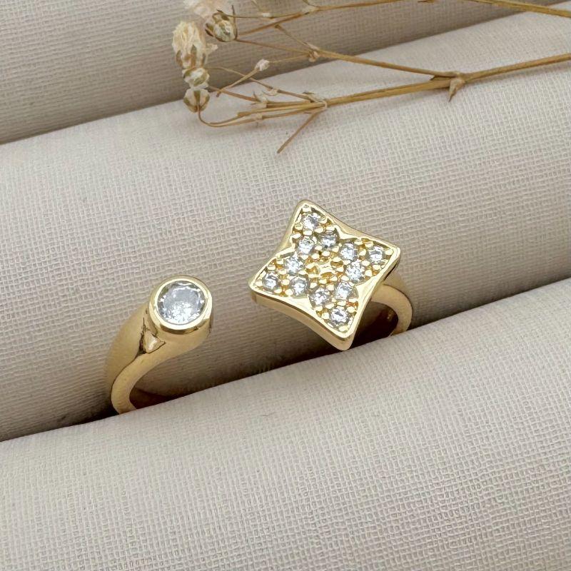 03.2322.1.O - (19 ao 21) Anel aberto com flor quatro pontas e ponto de luz em ingles nas pontas