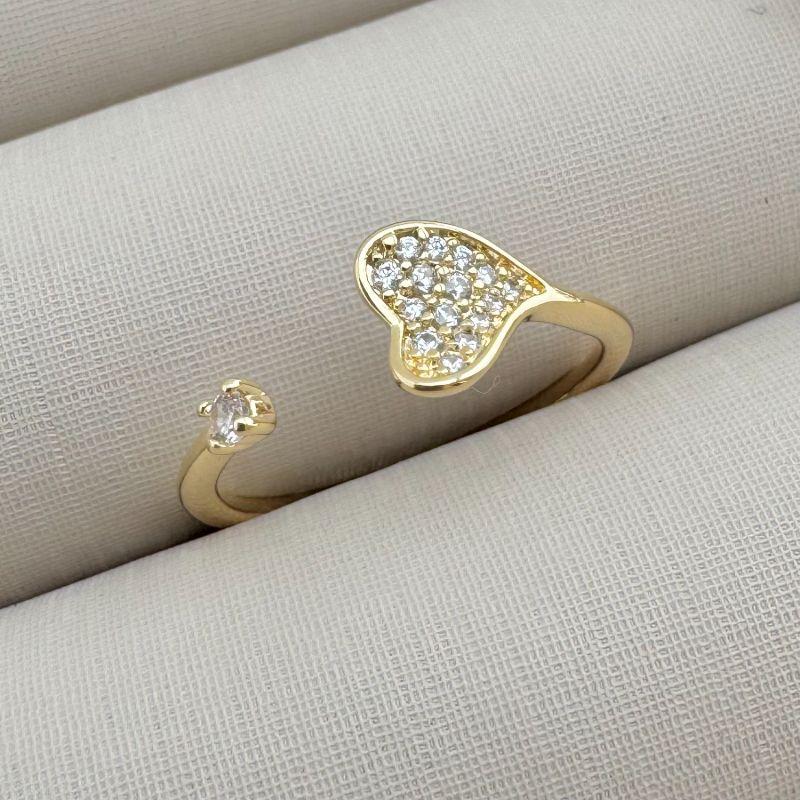 03.2323.1.O - (13 ao 17) Anel aberto de coraçao cravejado e ponto de luz nas pontas