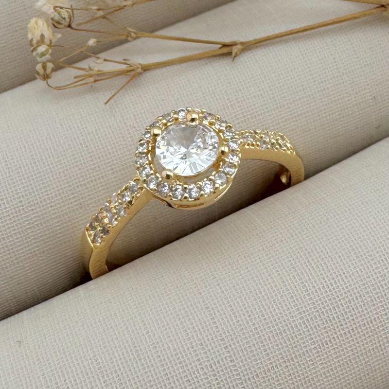 03.2329.1.O - (14) Anel solitario de quatro garras com uma fileira distante de cravação e aro semi cravejado