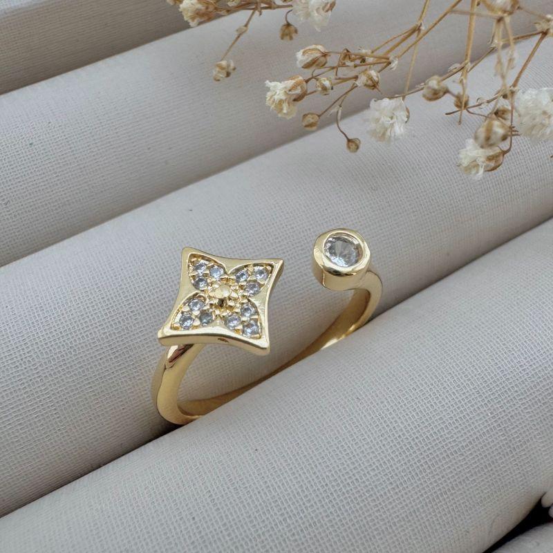 03.2344.1.O - (20 ao 22) Anel aberto com uma flor Luis e ponto de luz nas pontas