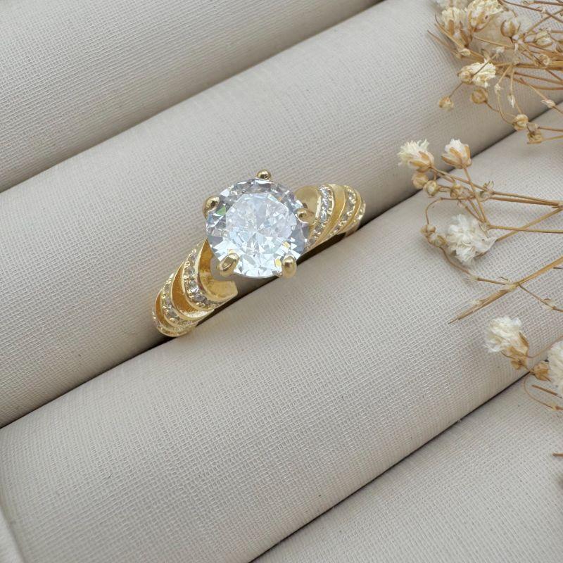 03.2360.1.O - (18) Anel solitario de cinco garras com aro em espiral cravejado