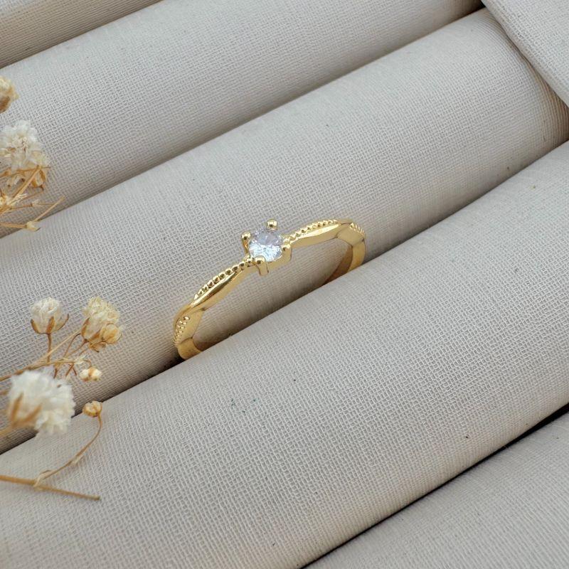 03.2382.1.O - (18) Anel solitario de quatro garras com aro efeito em espiral