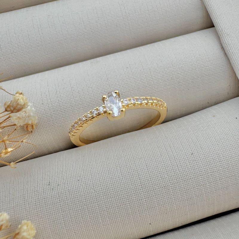 03.2388.1.O - (19) Anel solitario oval de garras com aro cravejado