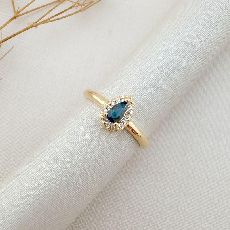 03.2449.4.O - (19) Anel solitário em gota de 9mm com uma coluna de cravação em volta