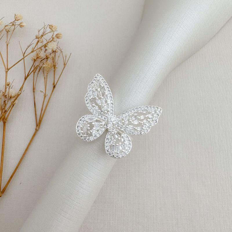 03.2482.1.S - (16) Anel de borboleta com cravação interna em baguete de silhueta em micro